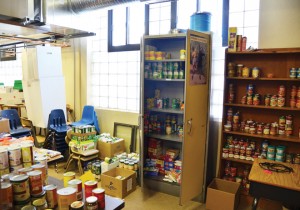 The food pantry at Our Lady of Guadalupe School fills a corner of the Reading Resource Room. The sister -school partnership between OLG and Notre Dame de Sion helped stock it. (Marty Denzer/Key photo)