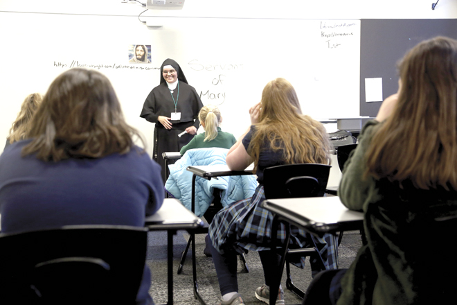 Sister Isabel Granados of the Sister Servants of Mary speaks on vocations to a classroom of girls at Vocations Days. (Megan Marley/Key photo)